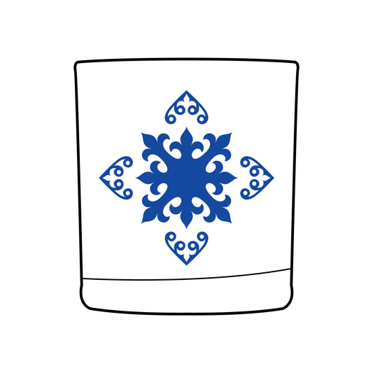 Design of decorative blue snowflake design on a whiskey glass