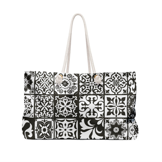 An oversized black and white Portuguese tile pattern tote bag with thick rope handles and a cream sheeting interior lining.