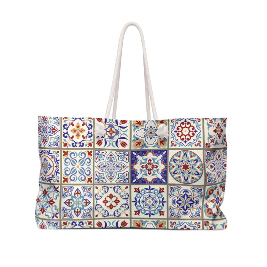 A Vibrant Portuguese tile pattern tote bag in blue, red, and yellow with rope handles.