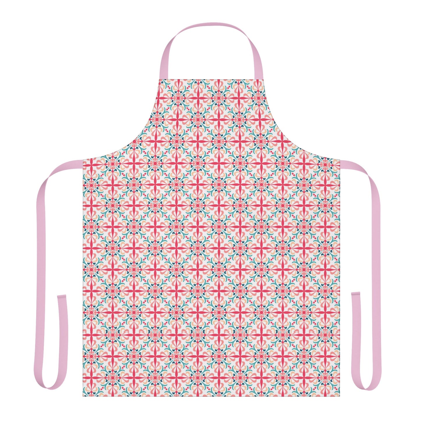 A person wearing a floral patterned apron in pink, green, and white colors standing in a kitchen setting.