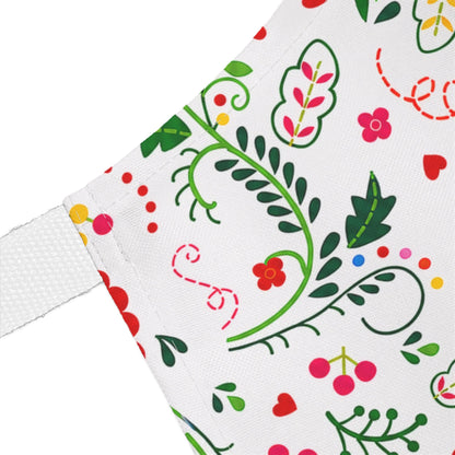 Close-up of a fabric with colorful floral and leaf pattern on a white background