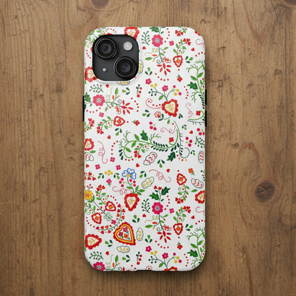 A white phone case featuring a dense, colorful folk-art style floral and heart pattern with green vines, red and pink flowers, and yellow accents, shown on a plain white background.