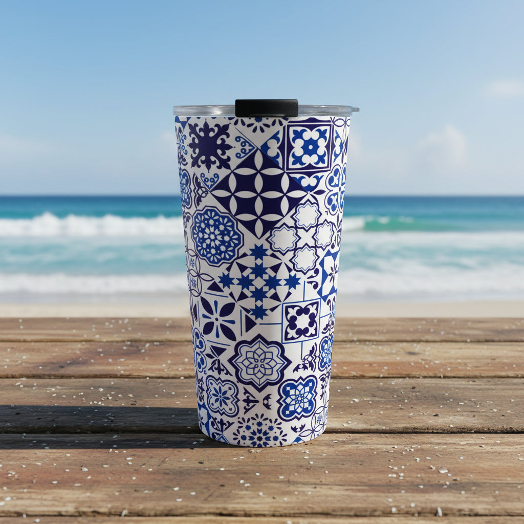 Tumbler with blue and white geometric pattern on a white background