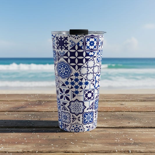 Tumbler with blue and white geometric pattern on a white background
