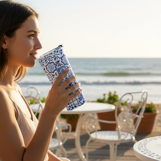 Tumbler with blue and white geometric pattern on a white background