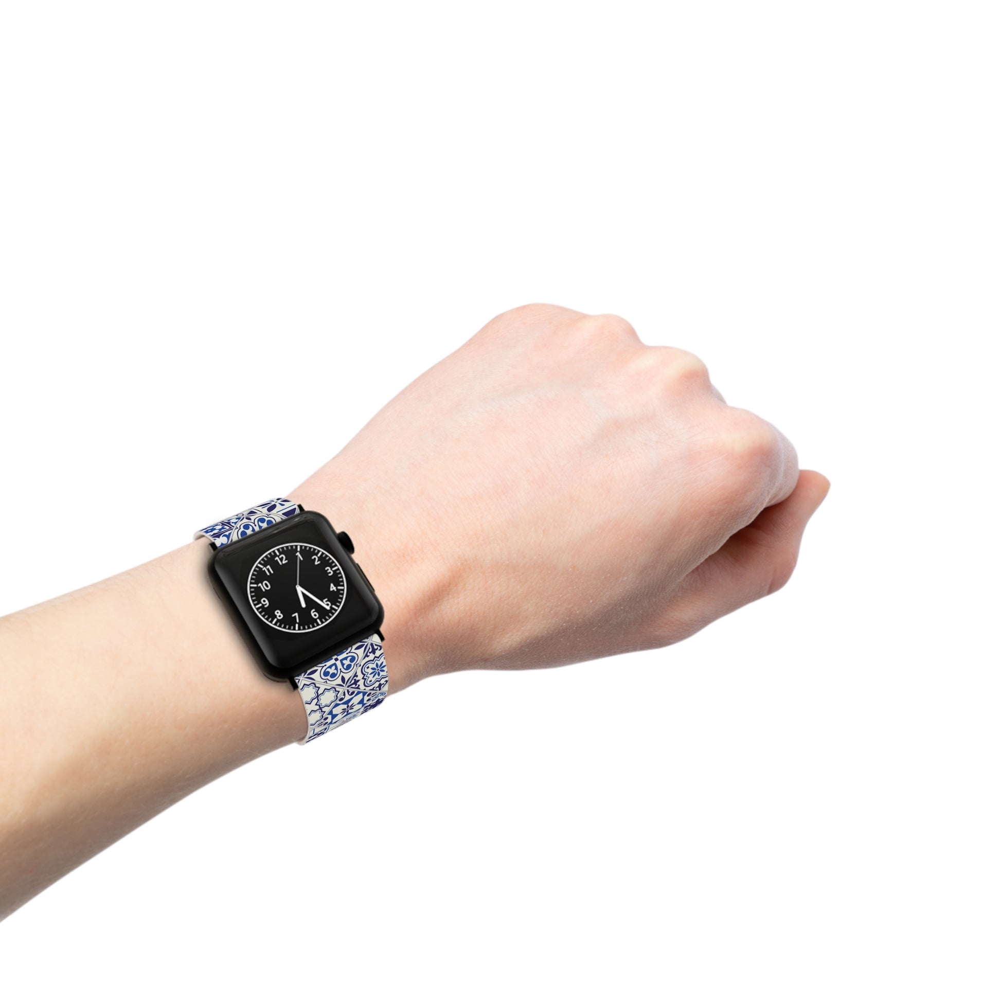 Hand wearing a smartwatch with a blue and white azulejo patterned band on a white background