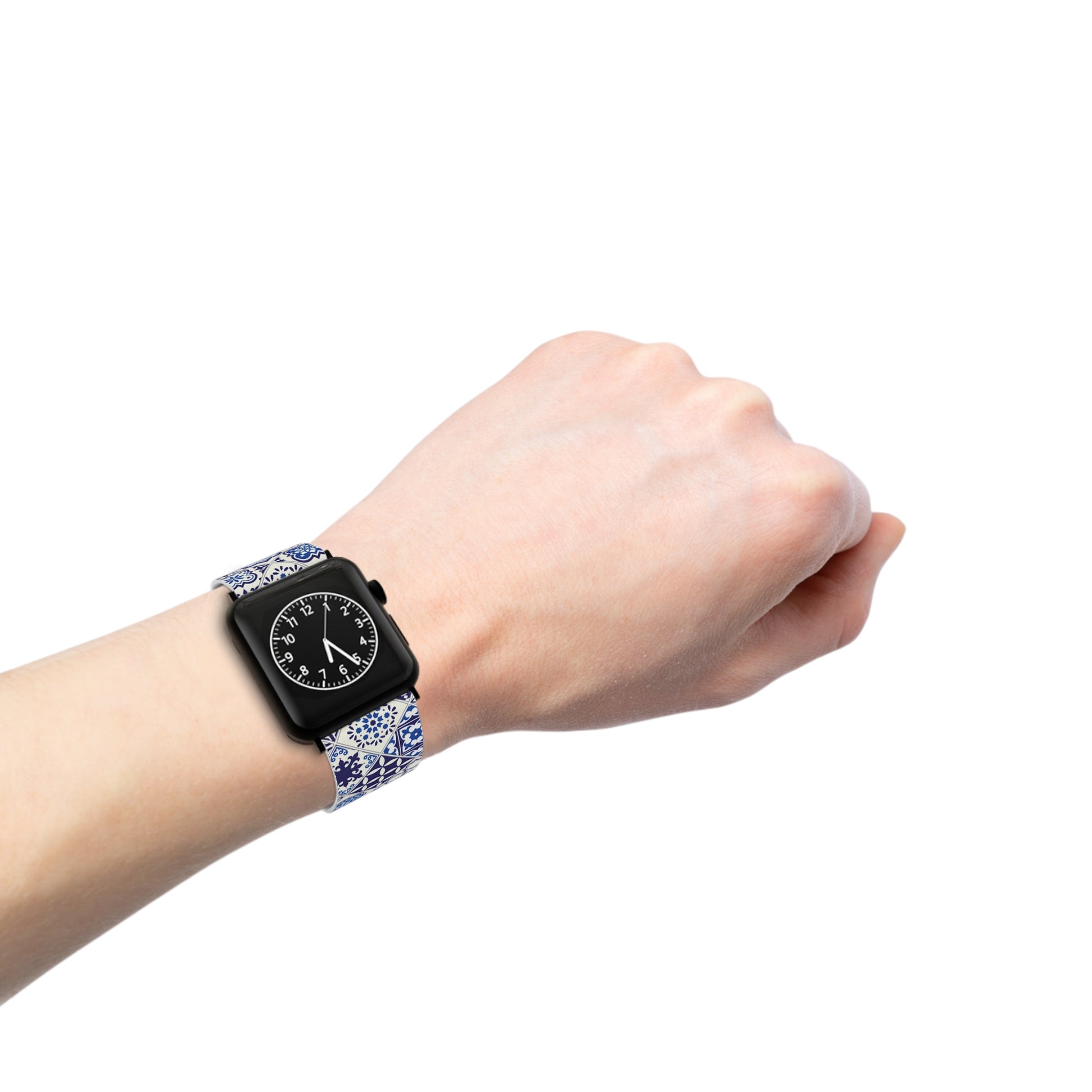 Hand wearing a smartwatch with a decorative blue and white tile band on a white background