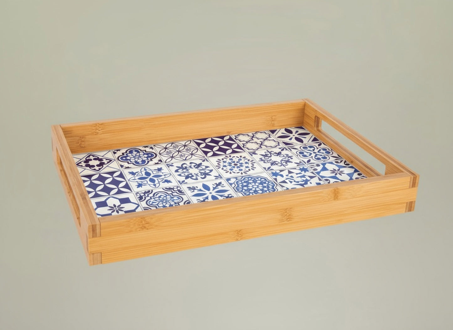 Bamboo tray with a blue and white tile patterned on a gray background