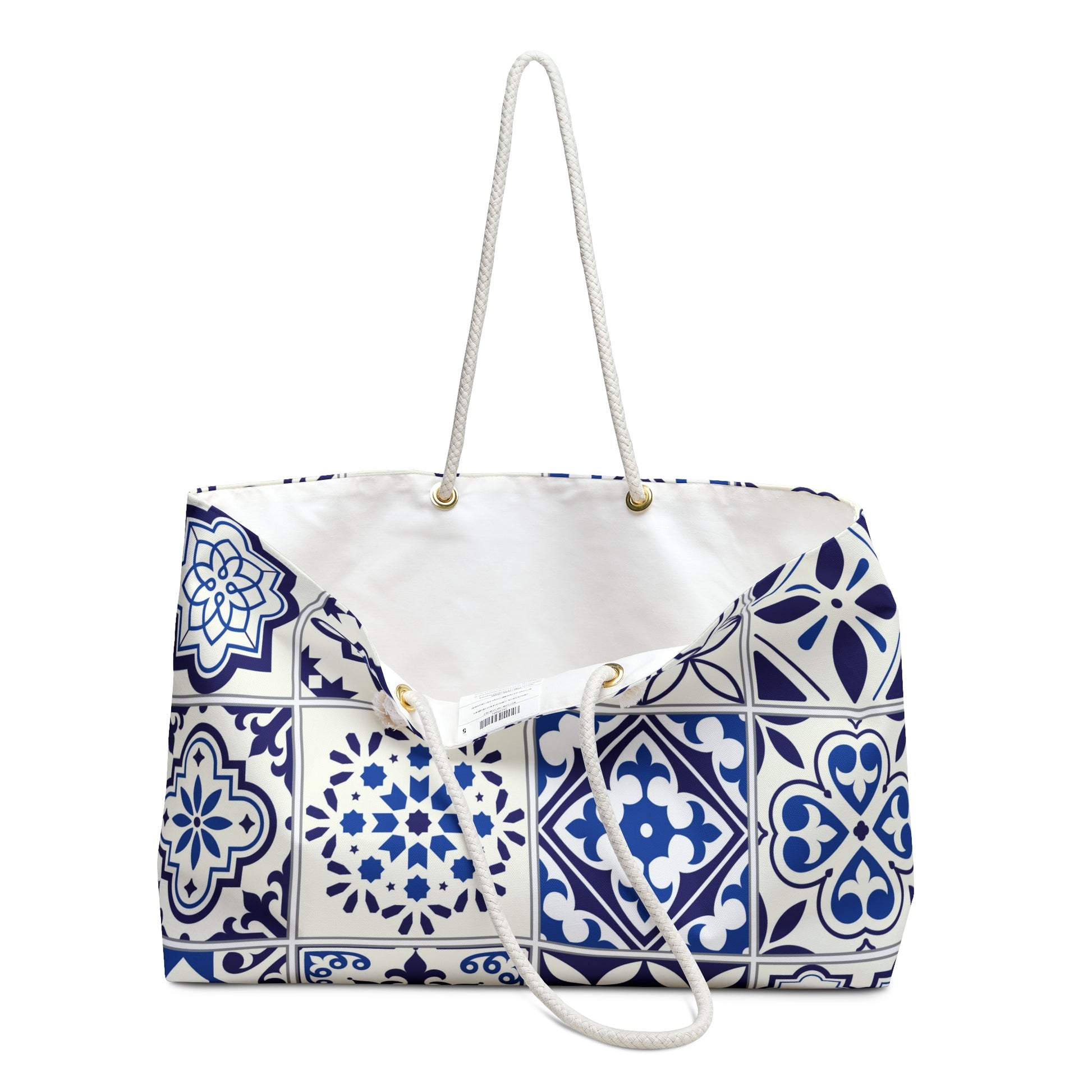 A large weekender tote bag with a blue and white Portuguese tile pattern and thick rope handles.