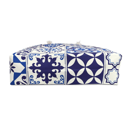 A large weekender tote bag with a blue and white Portuguese tile pattern and thick rope handles.