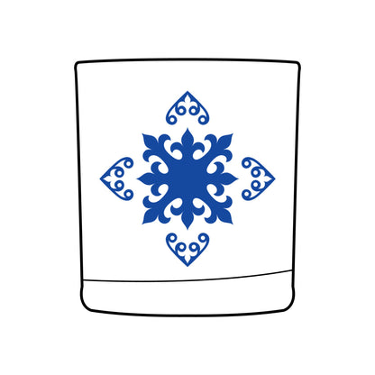 Design of decorative blue snowflake design on a whiskey glass