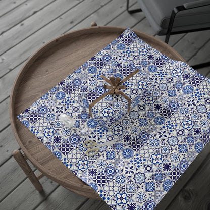 Decorative tablecloth with blue and white azulejo pattern on a wooden tray