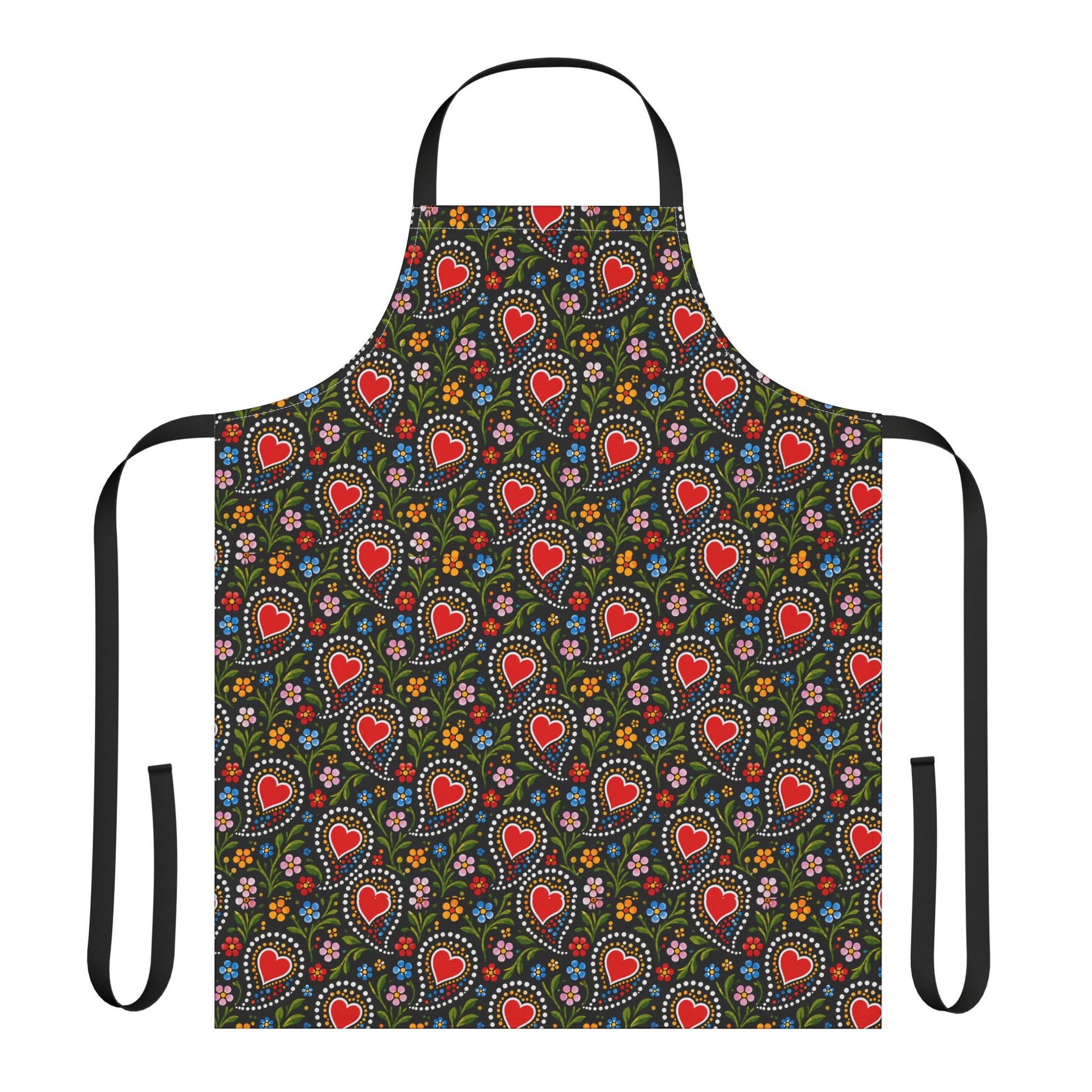 A black apron with a colorful repeating pattern of red hearts, white dotted circles, and small multicolored flowers, shown on a plain white background.