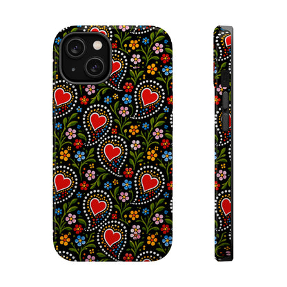 A phone case with a black background and a colorful folk-art style pattern featuring red hearts, green leaves, and small flowers, shown from the back and side on a white background.