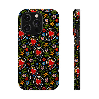 A phone case with a black background and a colorful folk-art style pattern featuring red hearts, green leaves, and small flowers, shown from the back and side on a white background.