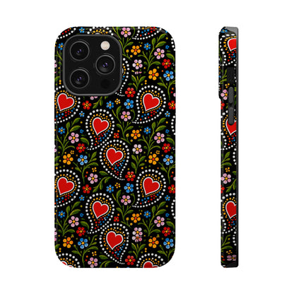 A black phone case with a colorful folk-art style pattern of red hearts, white dots, and small flowers, shown from the back and side on a white background.