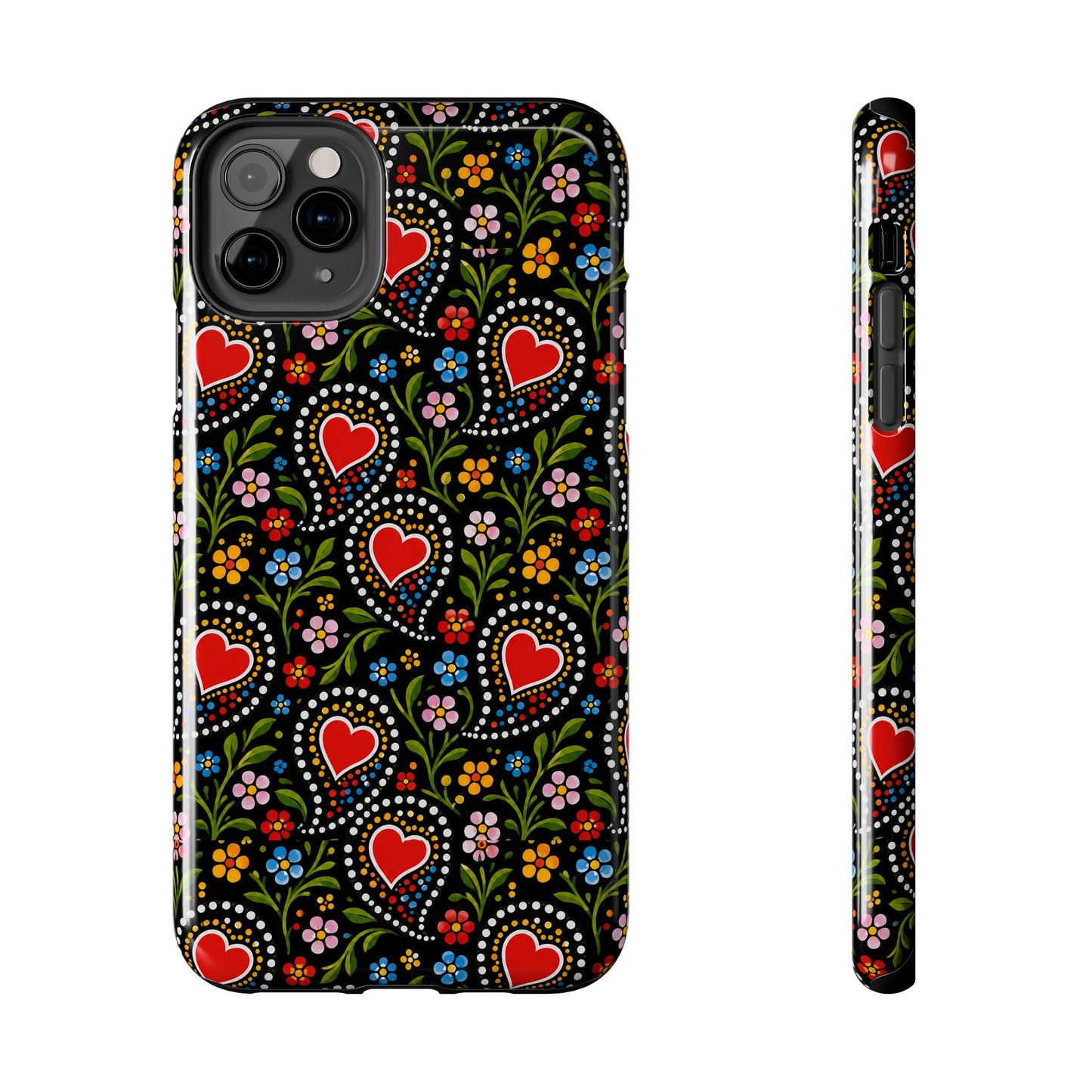 A phone case shown from the back and side on a plain white background. The case has a black base with a colorful folk-art style pattern featuring red hearts, green leaves, and small multicolored flowers.