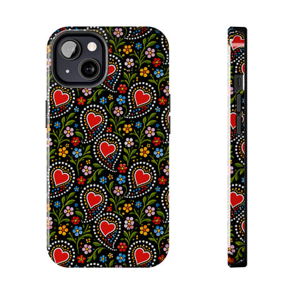 A phone case with a folk-art style pattern featuring red hearts, colorful flowers, and green leaves on a black background, shown from the back and side views against a white background.
