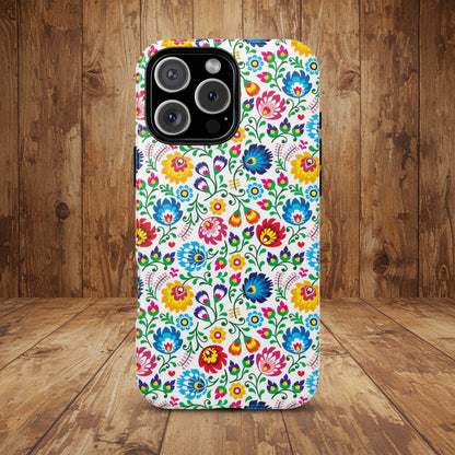 Phone case with colorful floral pattern on a wood background