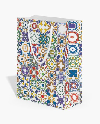 Colorful tile patterned gift bag on a white background