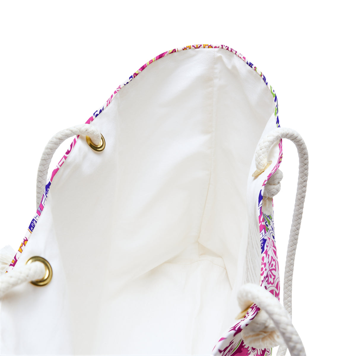 White drawstring bag with gold accents on a white background
