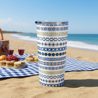 Tumbler with blue and yellow pattern on a white background