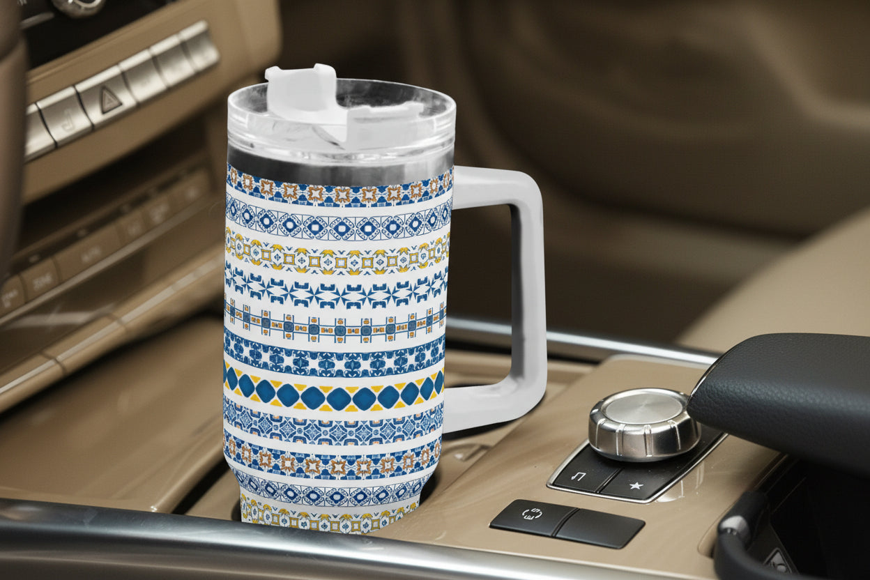 Patterned travel mug on a car dashboard