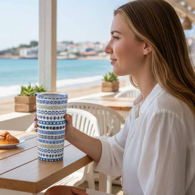 Tumbler with blue and yellow pattern on a white background