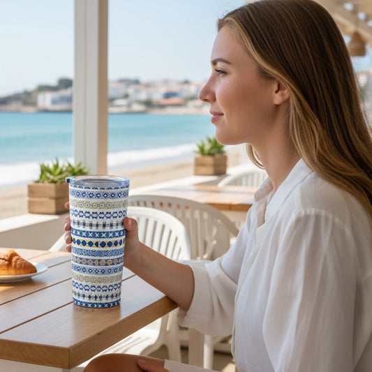 Tumbler with blue and yellow pattern on a white background