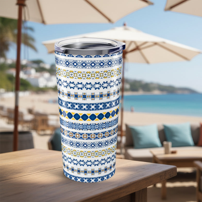 Tumbler with blue and yellow pattern on a white background