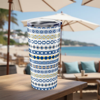 Tumbler with blue and yellow pattern on a white background