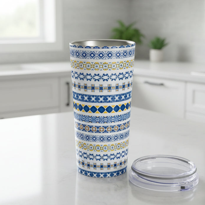 Tumbler with blue and yellow pattern on a white background