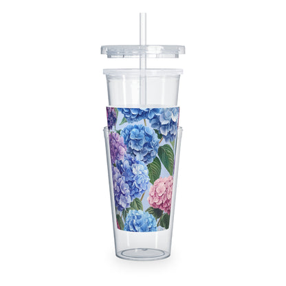 Clear tumbler with floral design on a white background