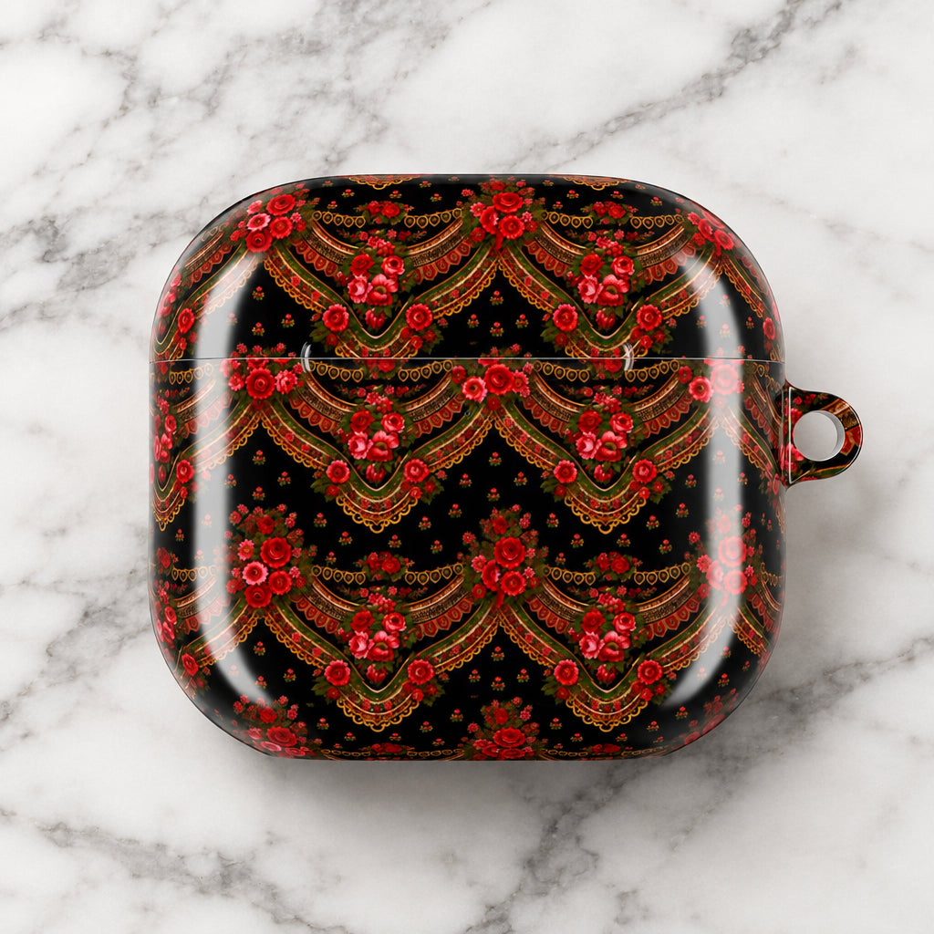 A glossy black protective case for AirPods featuring an intricate traditional Russian or Russian-style folk art pattern with red roses, gold accents, and green details, shown on a plain white background.