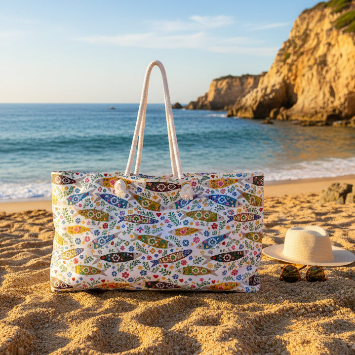 Colorful tote bag with fish and floral pattern on a white background