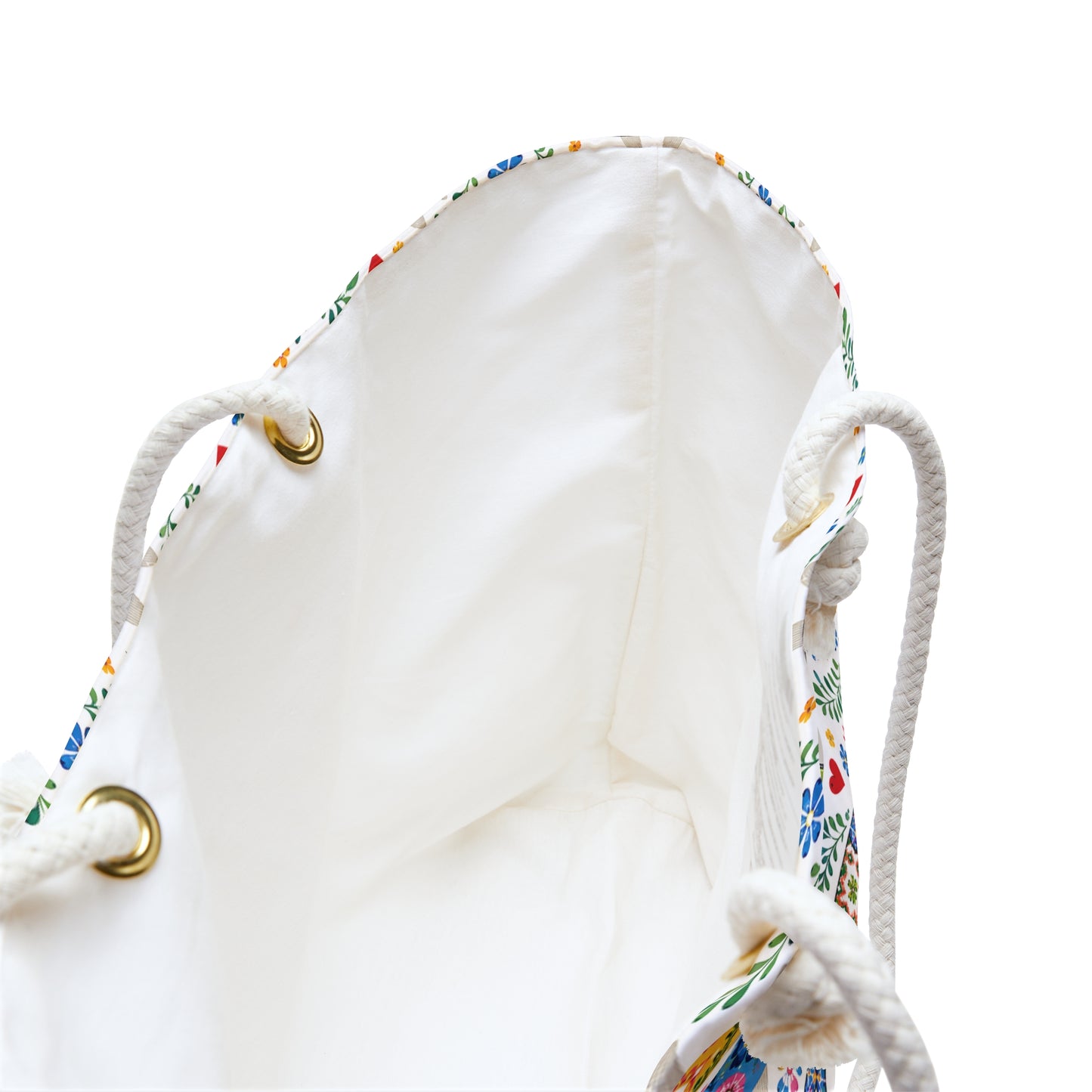 White drawstring bag with colorful floral patterns on a white background