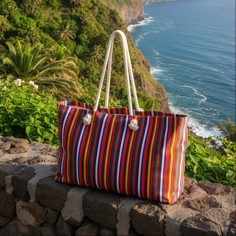 Colorful striped bag with white handles on a white background