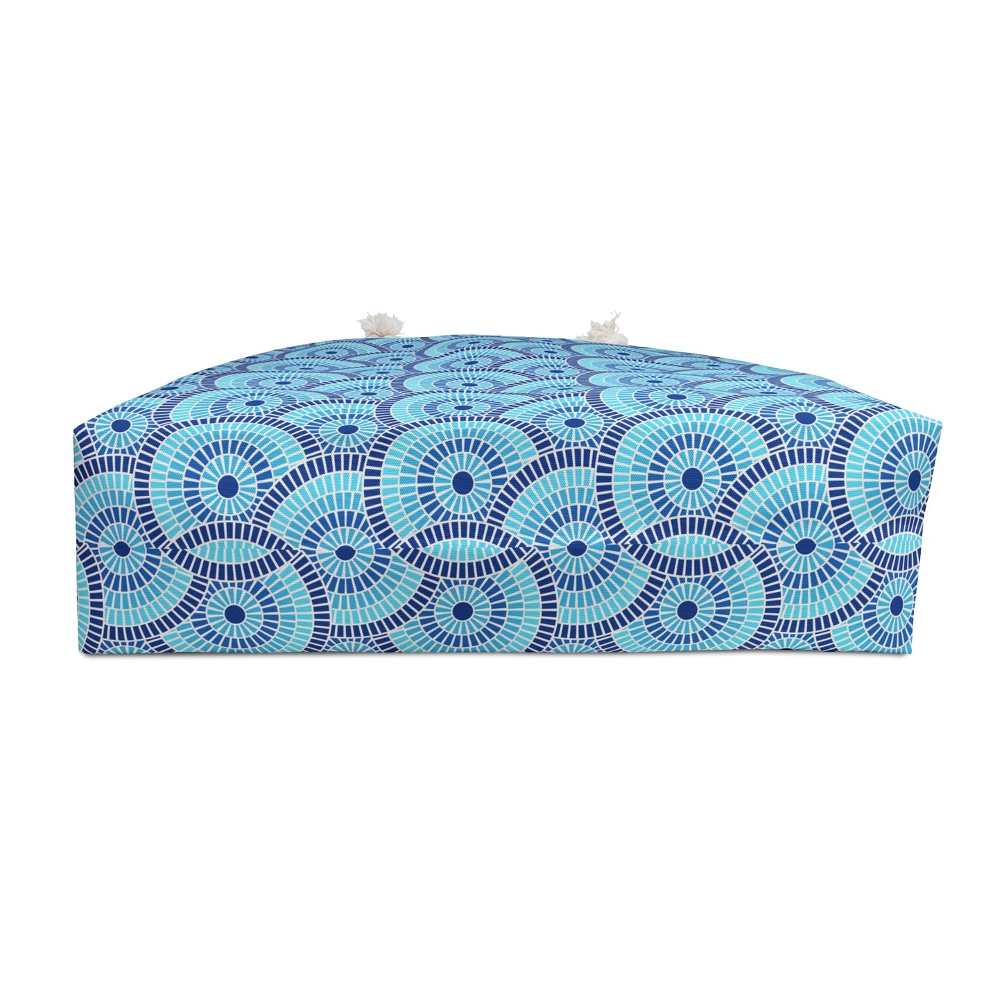 Blue and white patterned bag on a white background