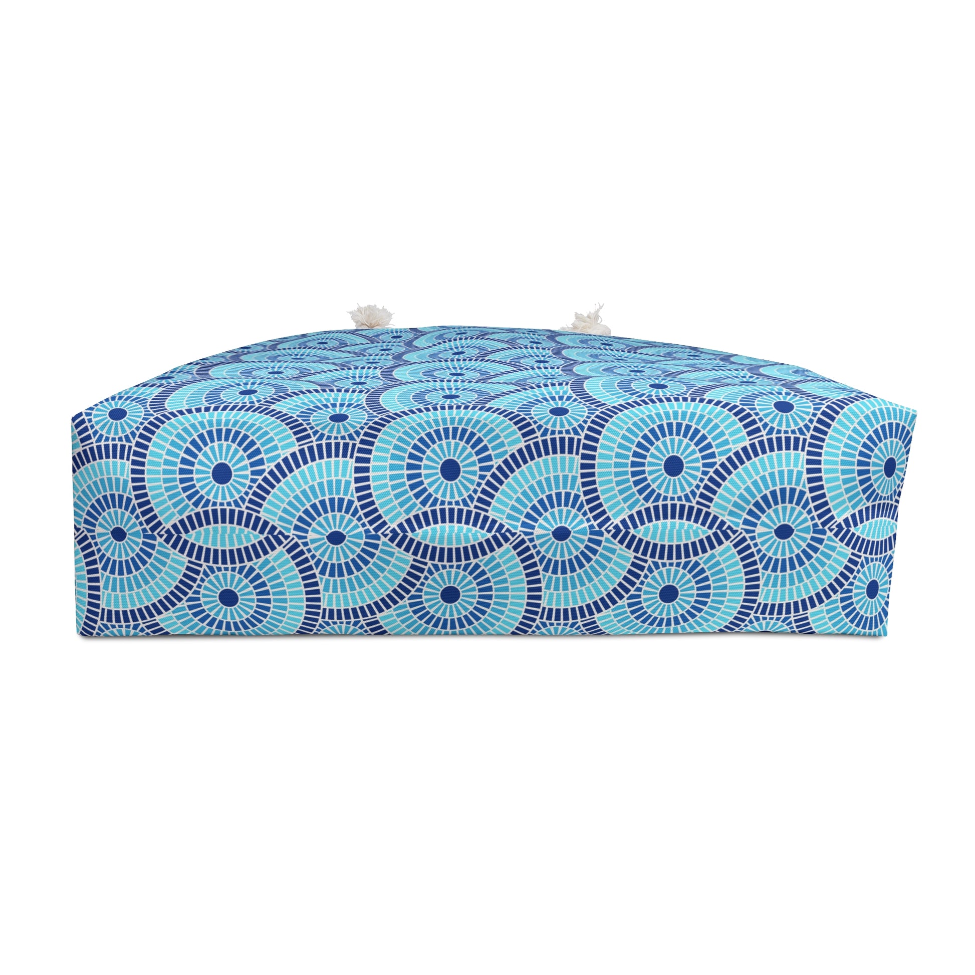 Blue and white patterned bag on a white background