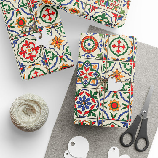 Decorative packages with colorful portuguese tile patterns, a ball of twine, and scissors on a white background