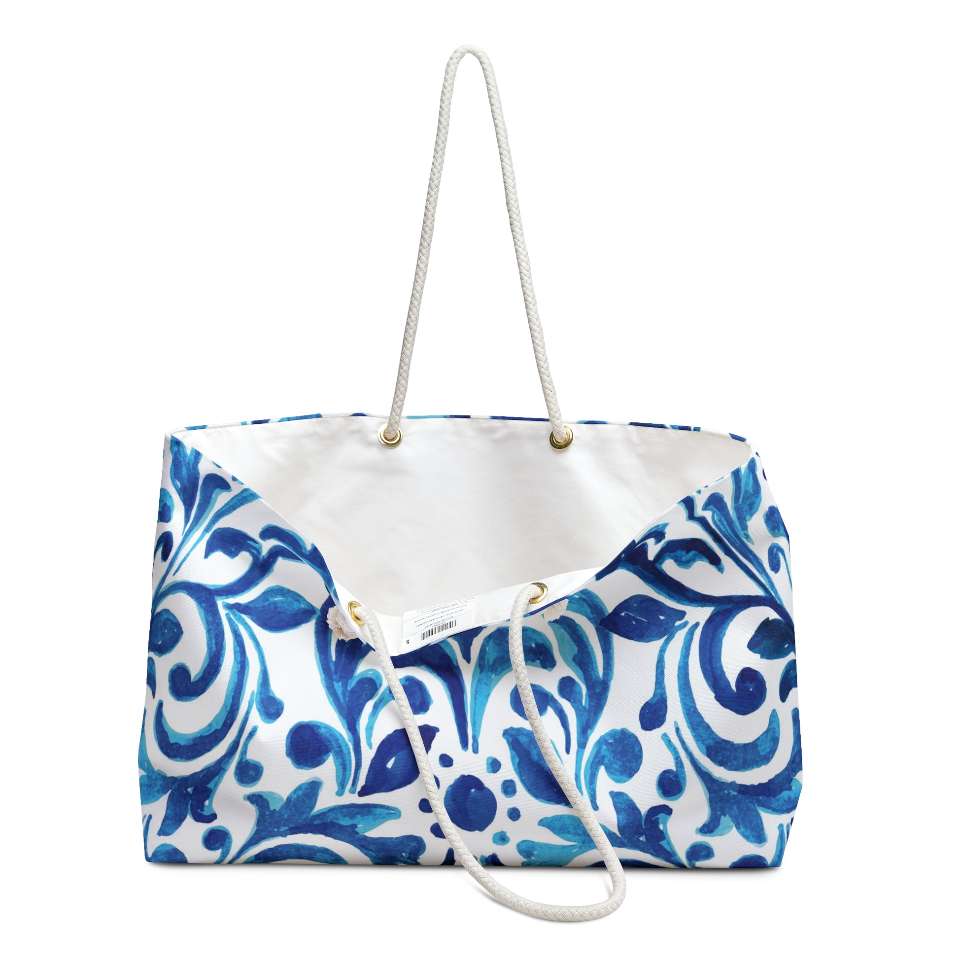 White bag with blue floral pattern on a white background