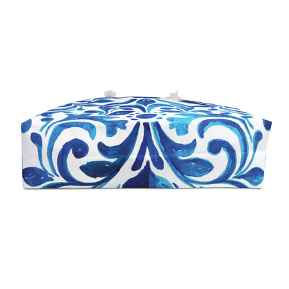 Blue and white patterned bottom of beach bag on a white background