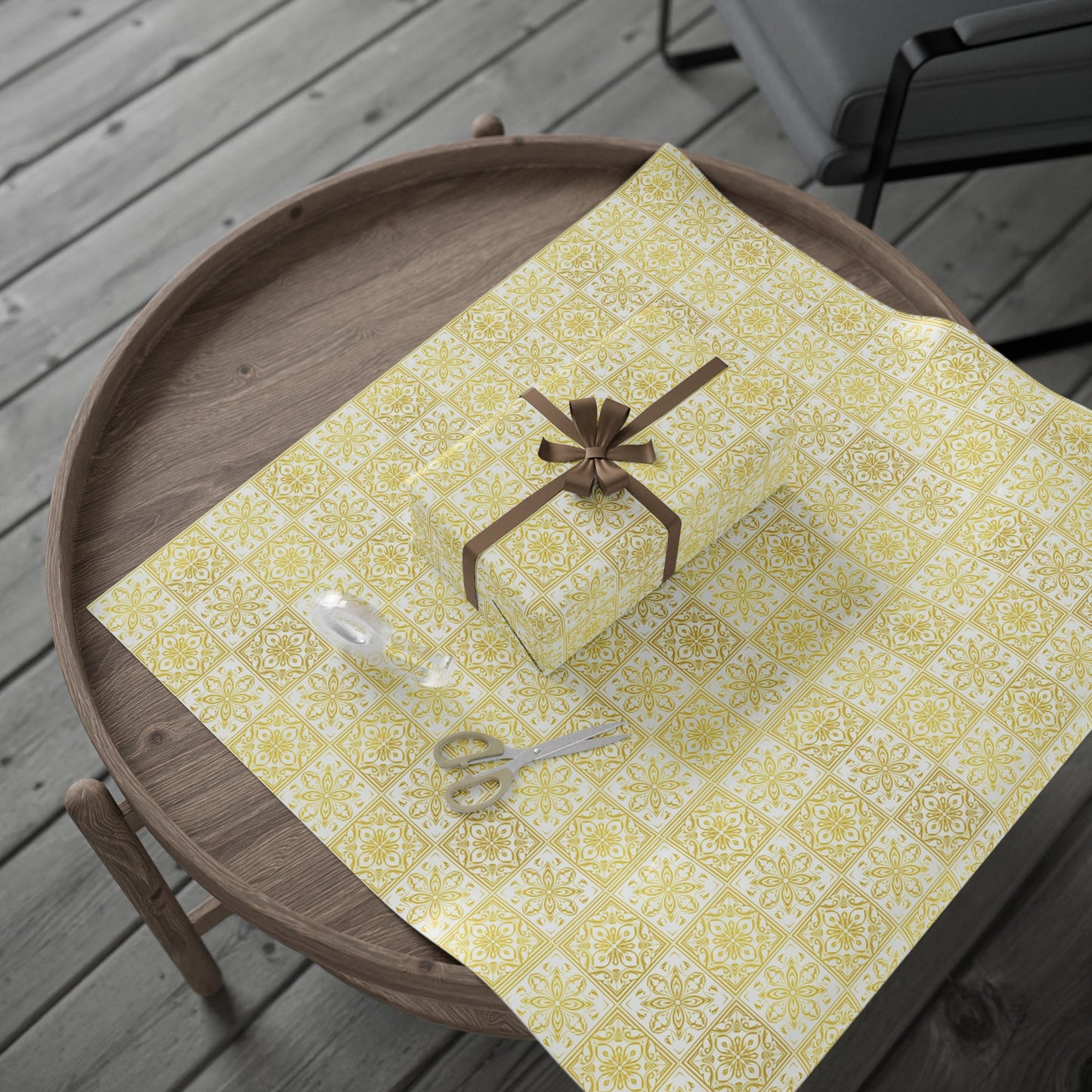 gold and white portuguese tile patterned paper with a small box and scissors on a wooden tray