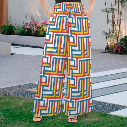 Colorful Wide-Leg Pants featuring a bold geometric maze pattern in red, blue, yellow, and white. High-waisted, comfortable palazzo style with a drawstring waist and pockets. Ideal for summer fashion, casual wear, resort wear, or retro/mod style looks. Bohemian, comfortable, vibrant trousers.