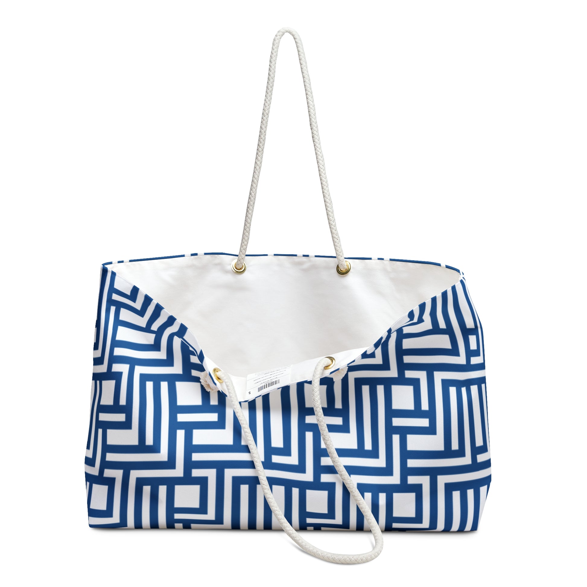 Blue and white geometric patterned bag with a white strap on a white background