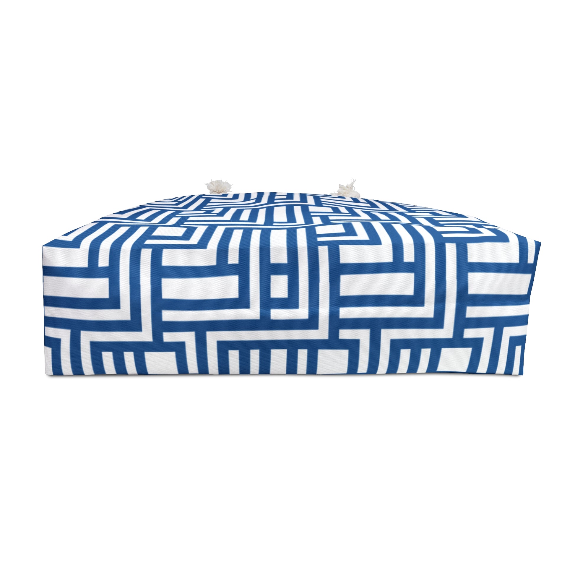 Blue and white geometric patterned bag bottom on a white background