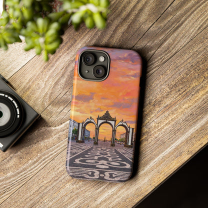 Phone case with architectural design on a wooden surface next to a camera