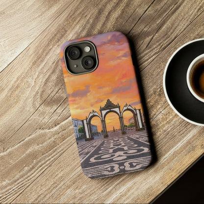 Phone case with architectural design on a wooden surface next to a camera