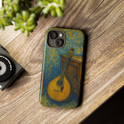 Phone case with mandolin design on a wooden surface next to a camera