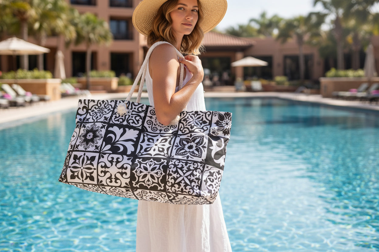 An oversized black and white Portuguese tile pattern tote bag with thick rope handles and a cream sheeting interior lining.